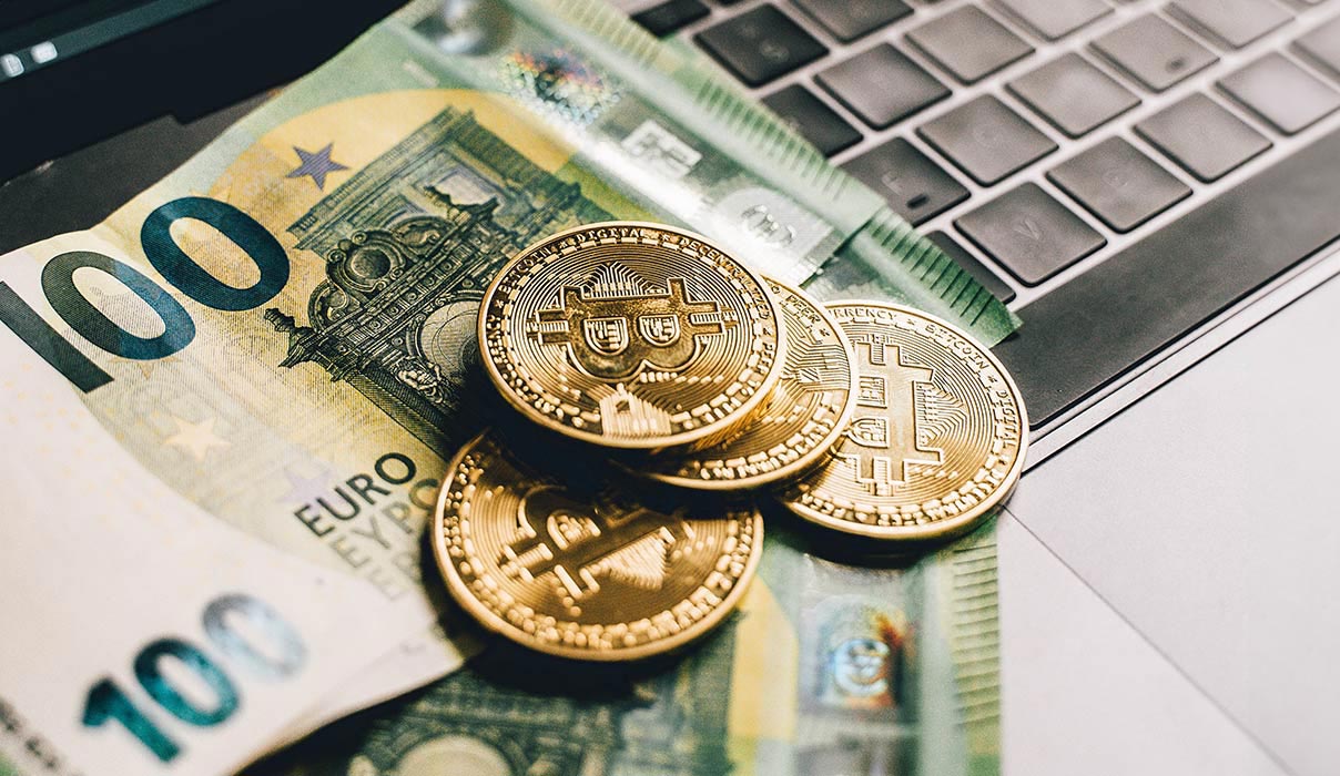 Money and Bitcoin on Keyboard Money and Bitcoin on Keyboard